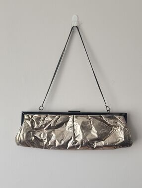 Aldo Metallic Gold Fold-Effect Clutch with Black Trim